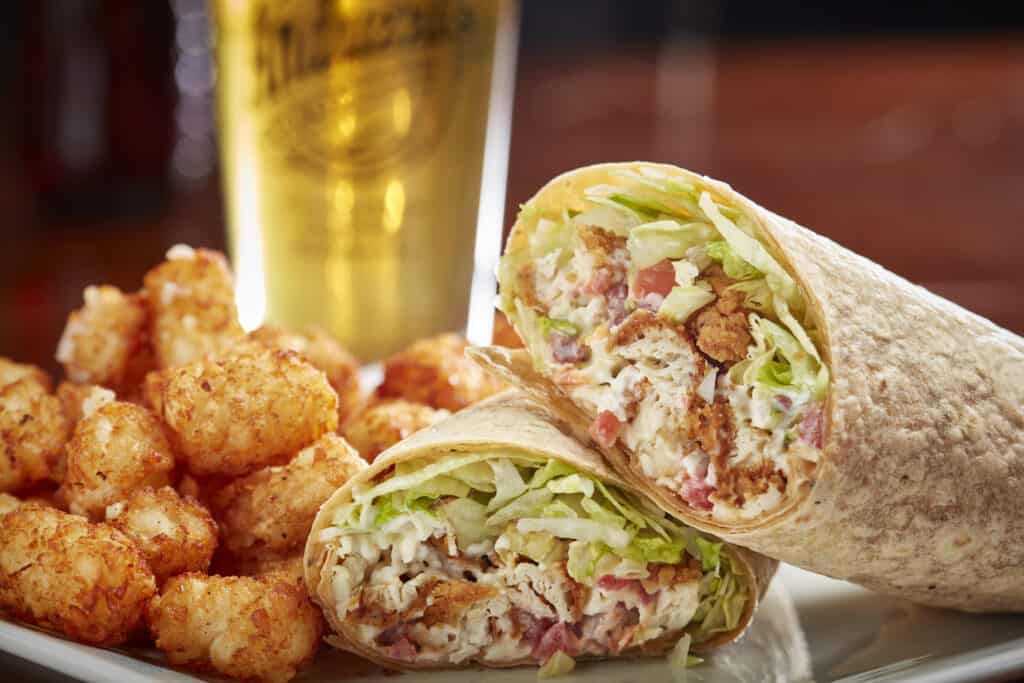 Grilled chicken breast, fresh lettuce, tomatoes, shredded cheeses and bacon with ranch dressing rolled in a garden vegetable wrap. $14.99