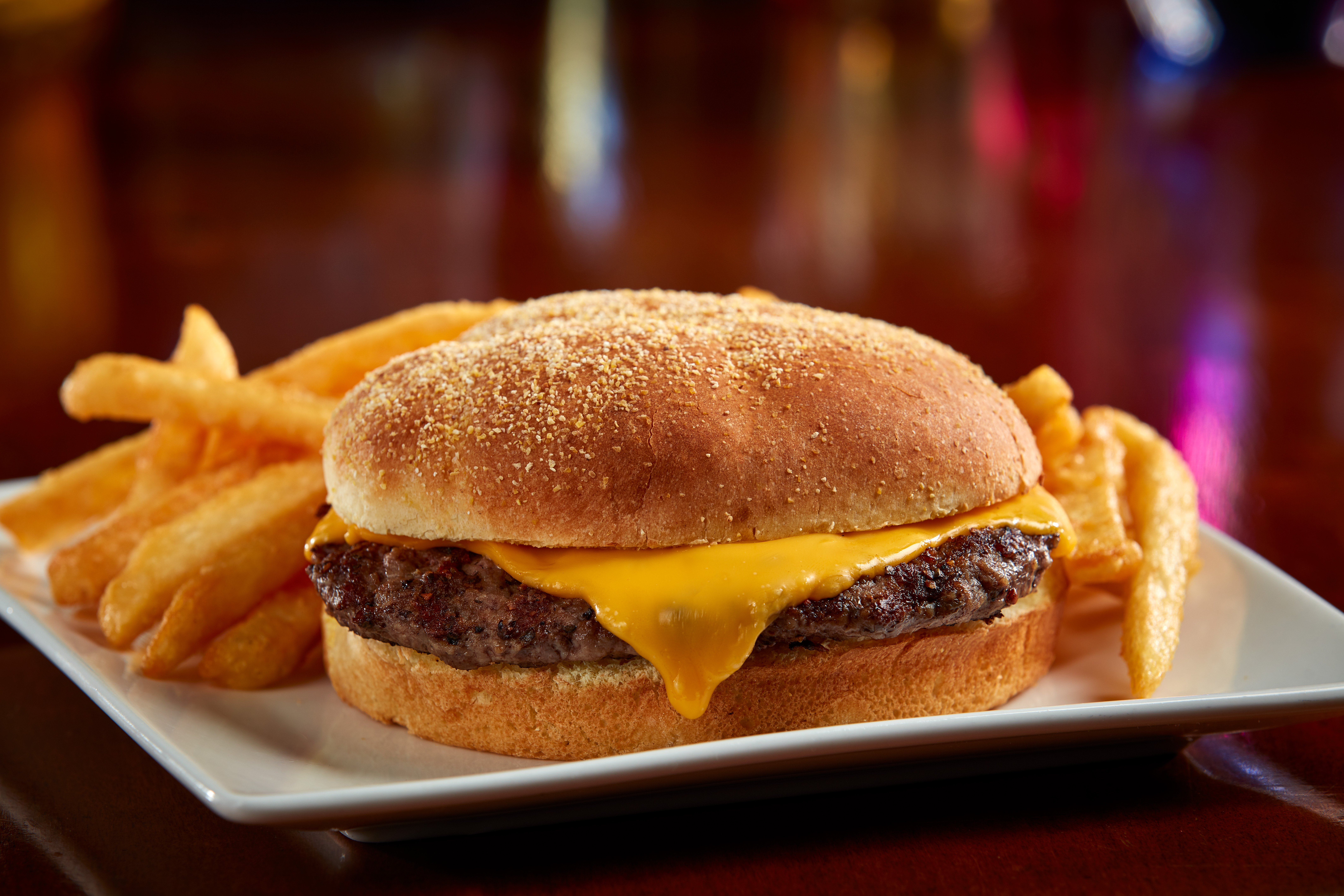 Grilled 4-oz burger with American cheese, served with French fries or fruit cup $7.99