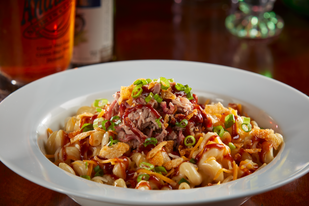 Cavatappi noodles in a six-cheese sauce topped with pulled pork and garnished with BBQ sauce, mesquite BBQ chips and green onions.  $15.99