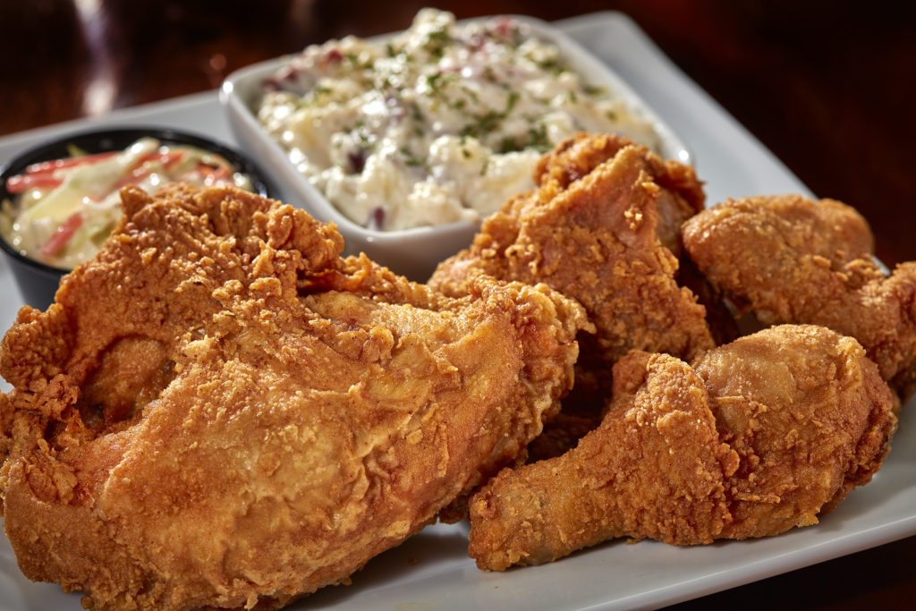 A four piece marinated chicken lightly breaded and broasted golden brown. Served with choice of side and coleslaw. $12.99