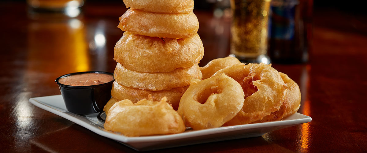 Stack of onion rings on a plate