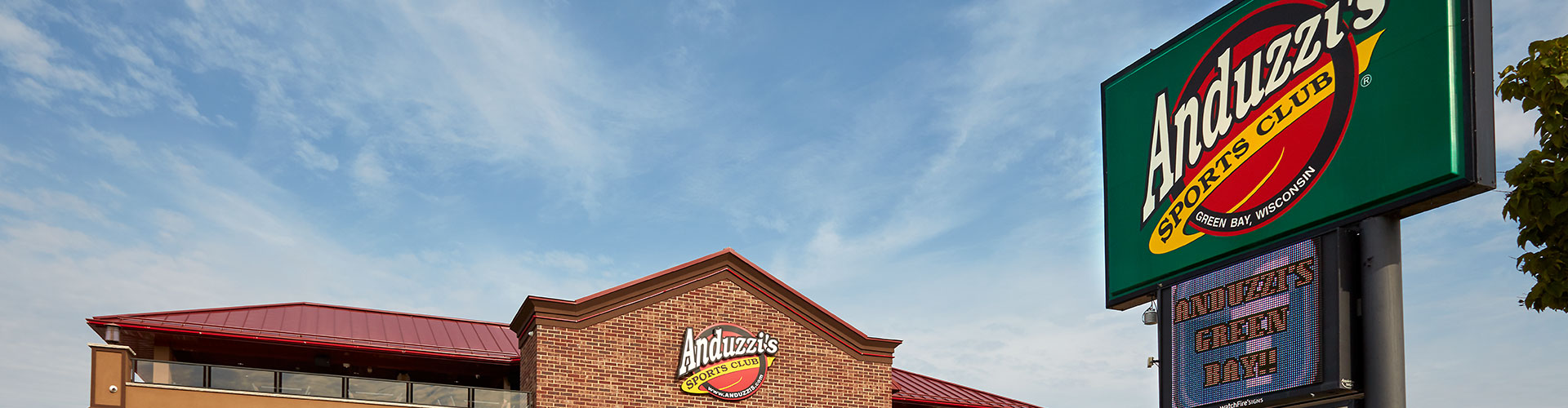 Anduzzi's sign with building in the background